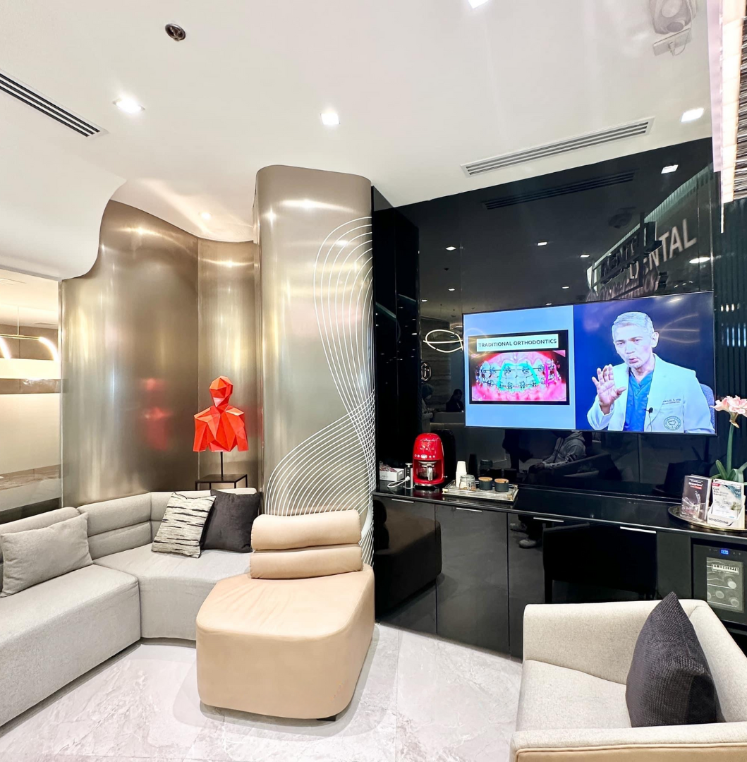 Urbidontics patient lounge with sculptural metallic partitions and seating inside the Abreeza Mall clinic.