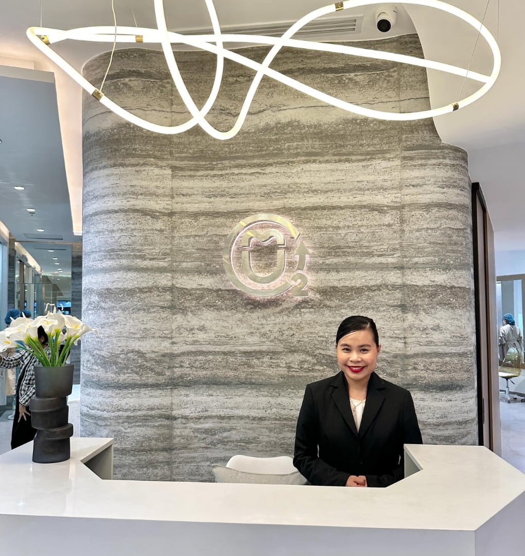 Urbidontics reception desk and a staff member inside the Abreeza Mall clinic, published in the clinic's official virtual tour.